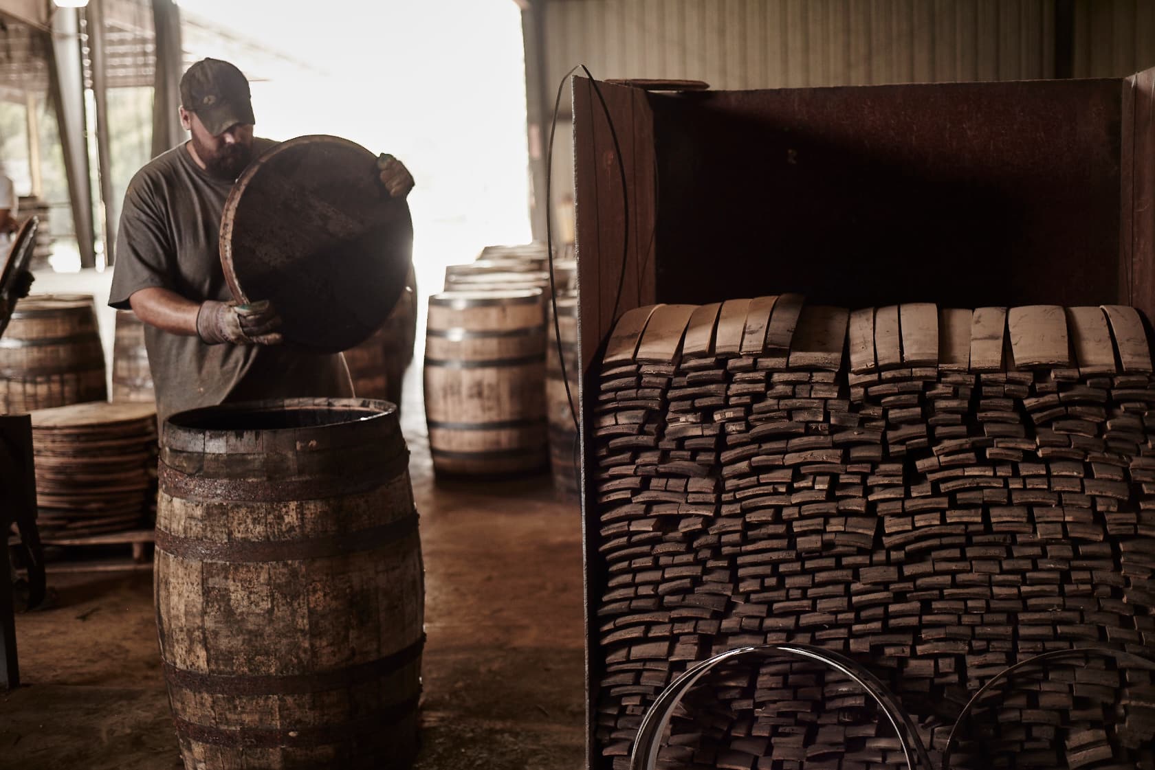 a man working with barrel