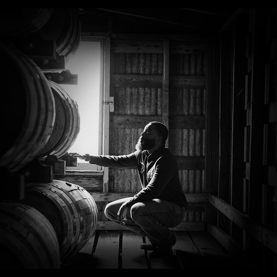 Inspecting Barrels in Warehouse